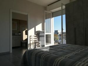 Postel nebo postele na pokoji v ubytování LE MURA Foresteria