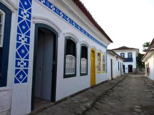 a building with blue and white paint on it at Casa da Matriz Centro Histórico in Paraty +8 photos