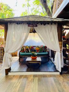 a living room with a couch and a table at Pousada João Sol in Praia do Forte