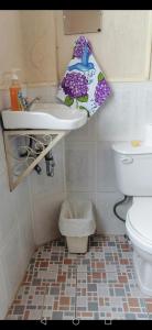 a bathroom with a sink and a toilet at Hotel Chalet in Chichicastenango