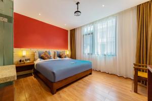 Llit o llits en una habitació de Enshi Grand Canyon Yutan Muyun Guesthouse