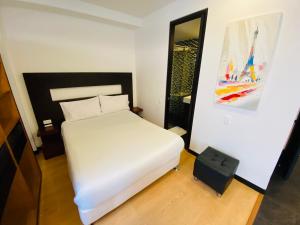 Krevet ili kreveti u jedinici u objektu Hotel Aparta Suite Continental Bogotá