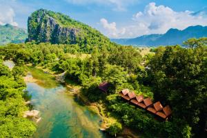 an aerial view of a river with trees and mountains at SpringRiver Resort in Ban O