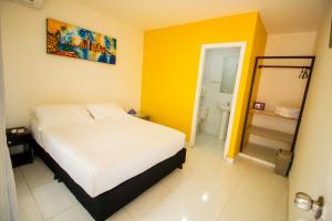 Postel nebo postele na pokoji v ubytování Hotel Balcones de Bocagrande