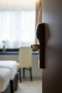 Postel nebo postele na pokoji v ubytování Zenith Hotel Caen