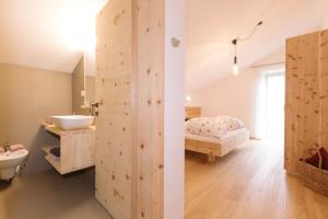 Tempat tidur dalam kamar di Ferienwohnung Sea Wieserhof