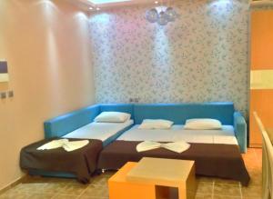 Кровать или кровати в номере Maranton Beach Hotel