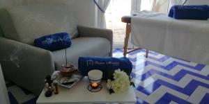 a living room with a couch and a table at Relais Maresca Luxury Small Hotel & Terrace Restaurant in Capri