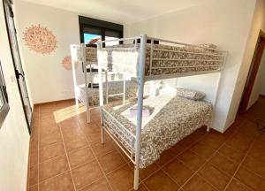 A bed or beds in a room at Las Casetas de Mateu
