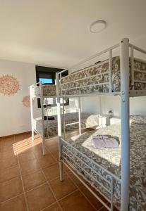 A bed or beds in a room at Las Casetas de Mateu