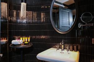 a bathroom with a sink and a mirror at La Sinfonía del Rey Hotel & Spa in Hanoi