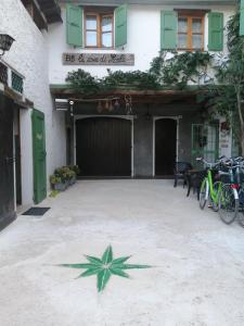 a star painted on the ground in front of a building at La Casa di Marla in Sirmione +3 photos