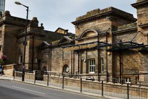 an old brick building on the side of a street at The Harrogate Abode in Harrogate