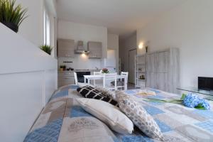 Postel nebo postele na pokoji v ubytování Le casette di Laura - Affitti Brevi Italia + 24 fotografií