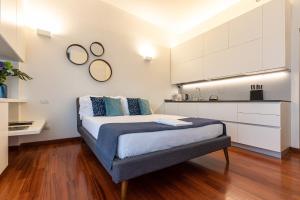 Posteľ alebo postele v izbe v ubytovaní BePlace Garibaldi Suites