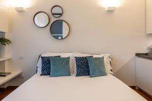 Posteľ alebo postele v izbe v ubytovaní BePlace Garibaldi Suites