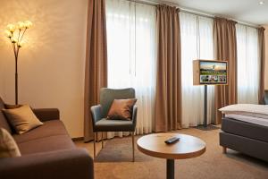 TV a/nebo společenská místnost v ubytování Esloher Brauhaus