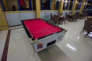 a ping pong table sitting on a floor in a restaurant at Euro Hotel and Apartments in Dar es Salaam