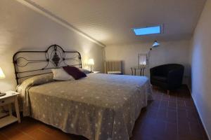 מיטה או מיטות בחדר ב-Ca la Caterina