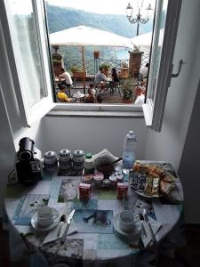 a view from a window of a table with food at Holiday Homes - mini spa - Nemi (Roma) in Nemi