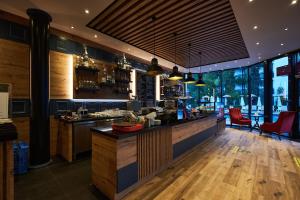 a large kitchen with a counter in a restaurant at Club Hotel Sera in Antalya