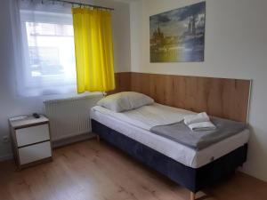 Łóżko lub łóżka w pokoju w obiekcie SZWEDZKA22 PL Premium Rooms