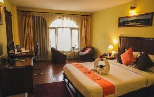 Postel nebo postele na pokoji v ubytování Hotel The Kantipur