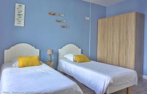 Un ou plusieurs lits dans un hébergement de l'établissement Queen Serenity Hotel