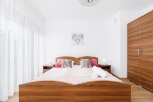 Posteľ alebo postele v izbe v ubytovaní Apartament Szarotka Kierpcówka 16 Kościelisko by Noclegi Renters