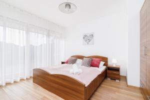 Posteľ alebo postele v izbe v ubytovaní Apartament Szarotka Kierpcówka 16 Kościelisko by Noclegi Renters