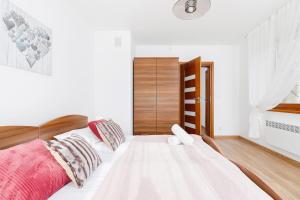 Posteľ alebo postele v izbe v ubytovaní Apartament Szarotka Kierpcówka 16 Kościelisko by Noclegi Renters
