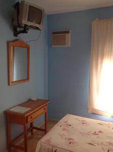 Telewizja i/lub zestaw kina domowego w obiekcie Hostal Los Amigos