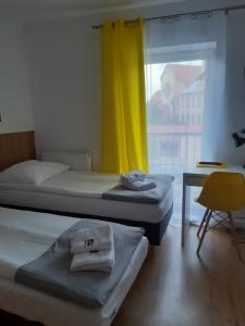 Łóżko lub łóżka w pokoju w obiekcie SZWEDZKA22 PL Premium Rooms