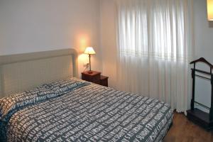 En eller flere senge i et værelse på Vielha centrico Calbeto FU