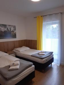Łóżko lub łóżka w pokoju w obiekcie SZWEDZKA22 PL Premium Rooms