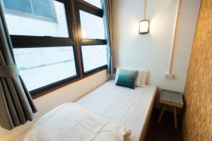Postel nebo postele na pokoji v ubytování Mystay Hostel Nan