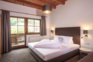 A bed or beds in a room at Vizensn Living