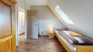 Ένα ή περισσότερα κρεβάτια σε δωμάτιο στο Ferienhaus Zur Mühle Mitling-Mark