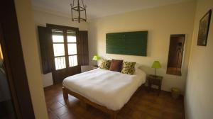 Postel nebo postele na pokoji v ubytování Casa Olea + 37 fotografií