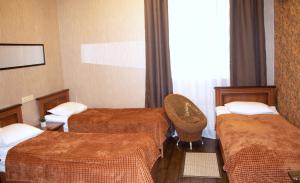 Postel nebo postele na pokoji v ubytování Bogdanov Yar Hotel