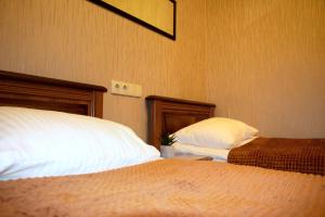 Postel nebo postele na pokoji v ubytování Bogdanov Yar Hotel