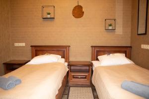 Postel nebo postele na pokoji v ubytování Bogdanov Yar Hotel