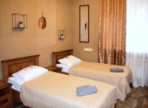 Postel nebo postele na pokoji v ubytování Bogdanov Yar Hotel