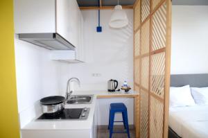 a small kitchen with a sink and a stove at Coordinat Suits in Izmir