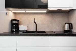 Kuchyňa alebo kuchynka v ubytovaní Apartments Warsaw Pawia by Noclegi Renters