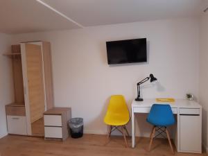 Telewizja i/lub zestaw kina domowego w obiekcie SZWEDZKA22 PL Premium Rooms