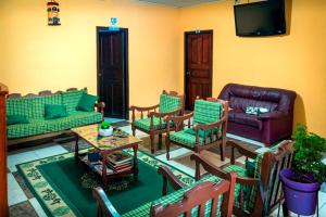 a living room with a couch and chairs at Zumag Sisa in Tena
