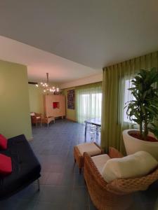 a living room with a couch and chairs and a table at Casa Beata 2 in Gallipoli