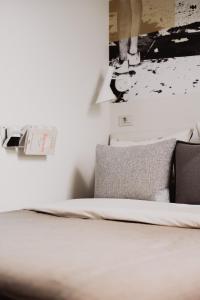 a bedroom with a bed and a picture on the wall at Select Sol in Madrid