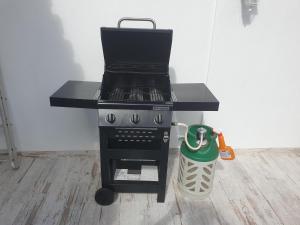 a black stove with a trash can next to it at Casa Tejo by Valada Village in Valada